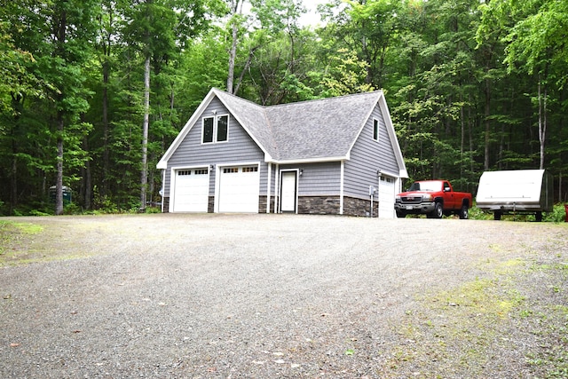 107 Shady Ln, Newport, ME 04953 - detached garage featuring a forest view