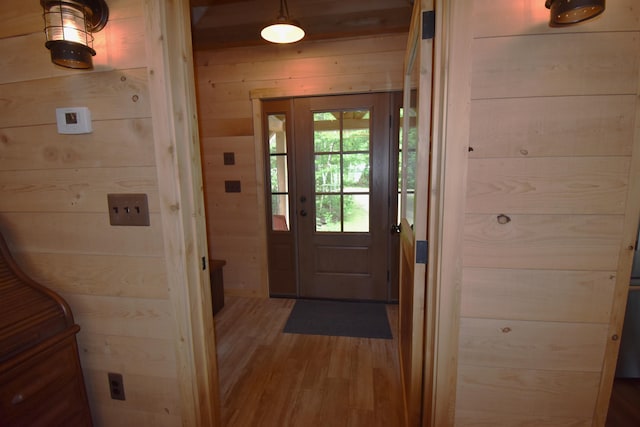 107 Shady Ln, Newport, ME 04953 - doorway featuring wood finished floors and wood walls
