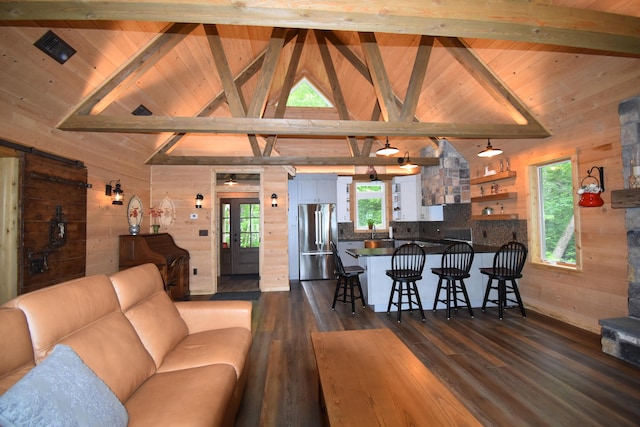 107 Shady Ln, Newport, ME 04953 - living room featuring wood walls, dark wood-style floors, and wooden ceiling