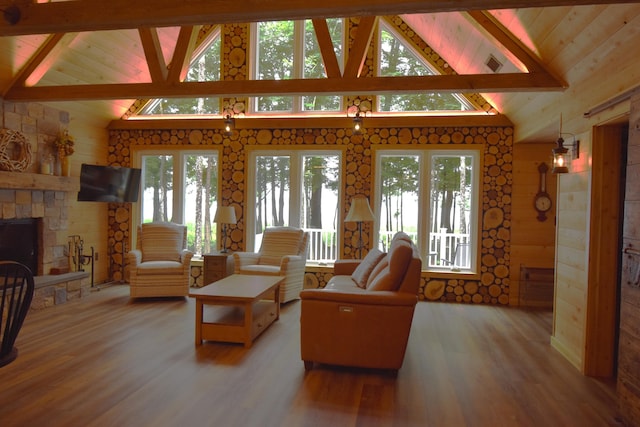 107 Shady Ln, Newport, ME 04953 - living area with wood finished floors, wooden ceiling, wooden walls, and a fireplace