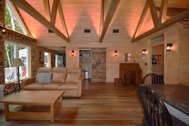 107 Shady Ln, Newport, ME 04953 - living room featuring high vaulted ceiling, light wood finished floors, wood walls, and a wood ceiling with exposed beams