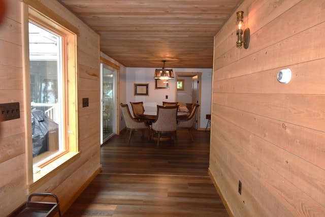 107 Shady Ln, Newport, ME 04953 - dining room with wooden ceiling, wood finished floors, wood walls, and a chandelier