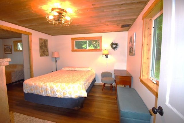 107 Shady Ln, Newport, ME 04953 - bedroom with wood ceiling, multiple windows, and wood finished floors
