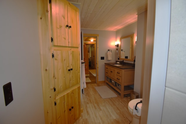 107 Shady Ln, Newport, ME 04953 - bathroom with vanity, wood finished floors, and wooden ceiling
