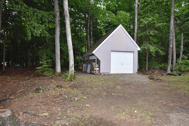 107 Shady Ln, Newport, ME 04953 - detached garage with dirt driveway and a wooded view