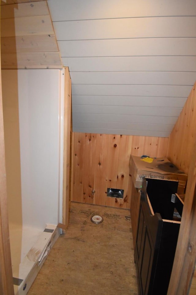 107 Shady Ln, Newport, ME 04953 - bathroom featuring wooden walls and vaulted ceiling