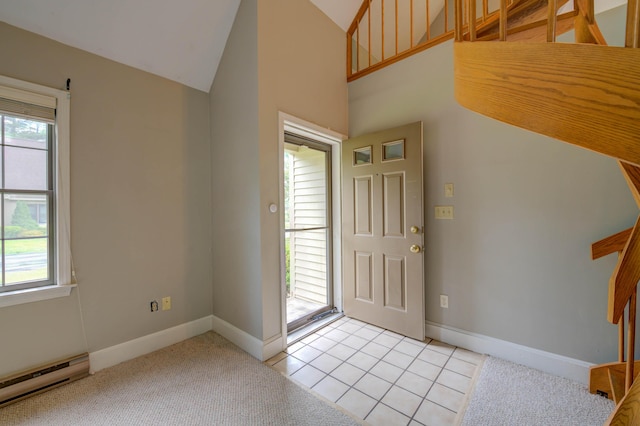 4 Cheshire Meadows Ln Unit 4, Kennebunk, ME 04043 - entrance foyer featuring a baseboard heating unit, healthy amount of natural light, light tile patterned floors, and high vaulted ceiling
