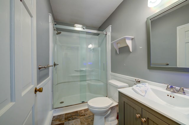 4 Cheshire Meadows Ln Unit 4, Kennebunk, ME 04043 - bathroom featuring a shower stall, vanity, and stone finish floors