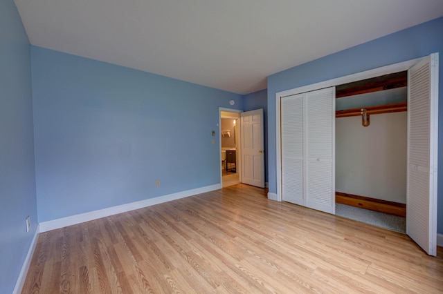 4 Cheshire Meadows Ln Unit 4, Kennebunk, ME 04043 - unfurnished bedroom featuring light wood-style flooring and a closet