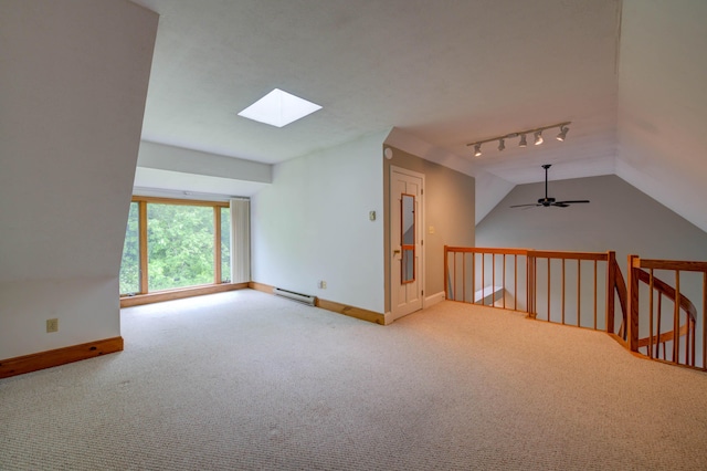 4 Cheshire Meadows Ln Unit 4, Kennebunk, ME 04043 - carpeted spare room featuring rail lighting, a skylight, a baseboard radiator, lofted ceiling, and a ceiling fan