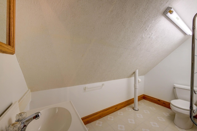 4 Cheshire Meadows Ln Unit 4, Kennebunk, ME 04043 - bathroom with lofted ceiling and a textured ceiling