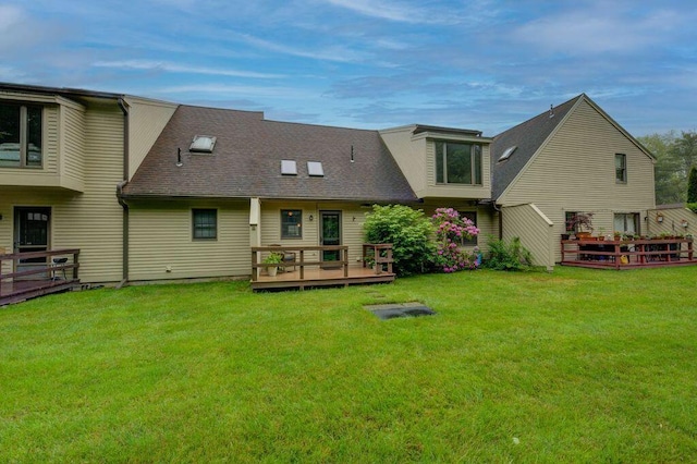 4 Cheshire Meadows Ln Unit 4, Kennebunk, ME 04043 - back of property with a wooden deck, a lawn, and a shingled roof