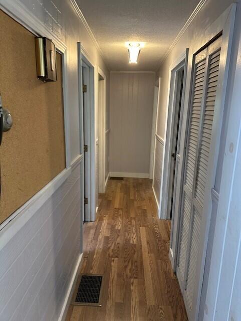 2073 Western Ave, Newburgh, ME 04444 - hallway featuring wood finished floors and ornamental molding