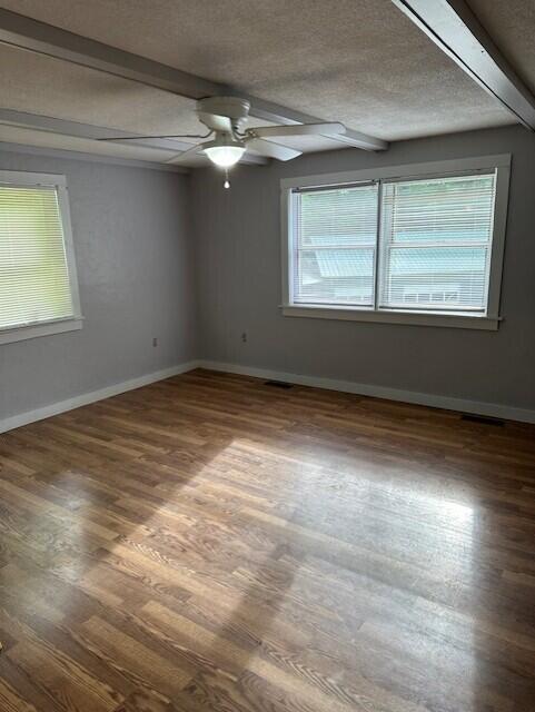 2073 Western Ave, Newburgh, ME 04444 - spare room with wood finished floors, a ceiling fan, and a textured ceiling