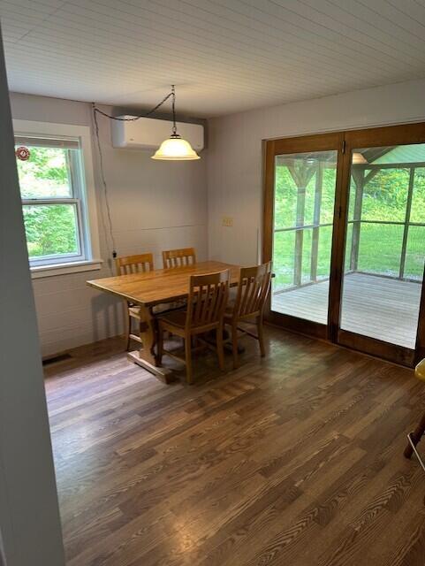 2073 Western Ave, Newburgh, ME 04444 - dining space with wood finished floors and a wall mounted AC