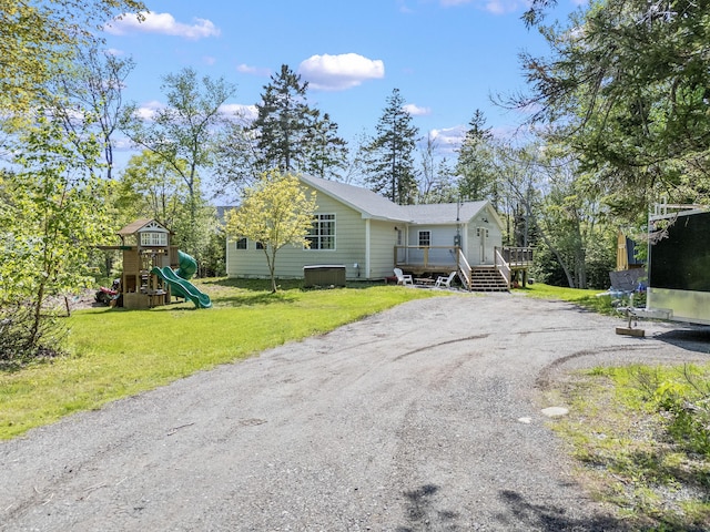 665 Hendricks Hill Rd, Southport, ME 04576 - view of property exterior featuring a playground, a lawn, dirt driveway, and a deck