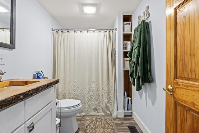 665 Hendricks Hill Rd, Southport, ME 04576 - full bathroom featuring vanity, wood finished floors, and a shower with shower curtain