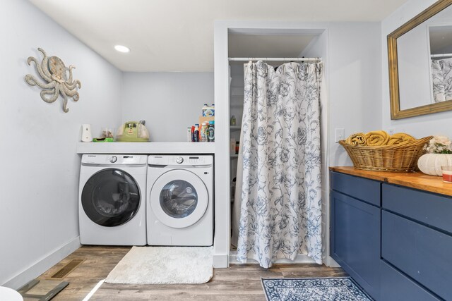 665 Hendricks Hill Rd, Southport, ME 04576 - laundry room featuring washing machine and clothes dryer and wood finished floors