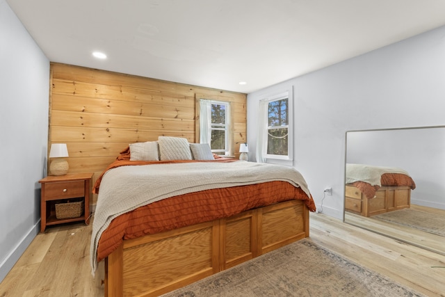 665 Hendricks Hill Rd, Southport, ME 04576 - bedroom featuring light wood-style floors, recessed lighting, and wood walls
