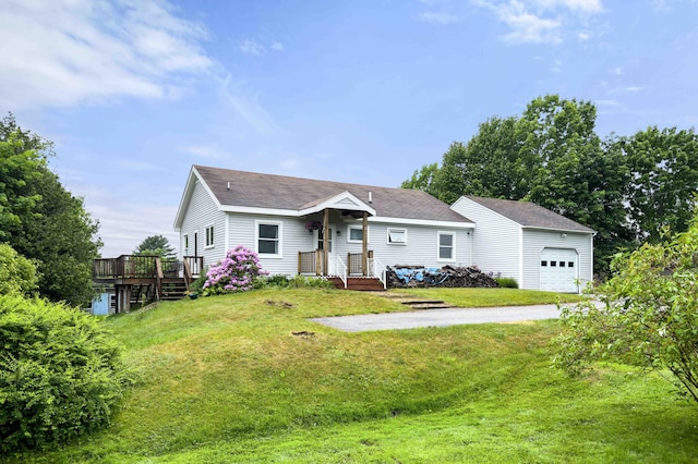 94 Depot St, Waldoboro, ME 04572 - view of front of house featuring a front lawn, an attached garage, driveway, a wooden deck, and roof with shingles