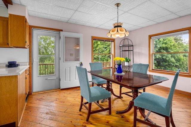 94 Depot St, Waldoboro, ME 04572 - dining space with light wood-style floors and a chandelier