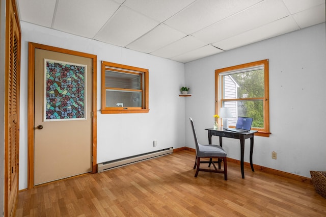 94 Depot St, Waldoboro, ME 04572 - home office featuring a baseboard heating unit, a paneled ceiling, and light wood-style floors