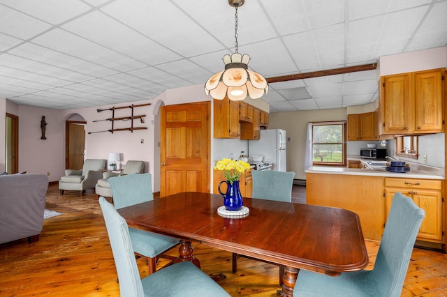 94 Depot St, Waldoboro, ME 04572 - dining space featuring arched walkways and light wood-style flooring