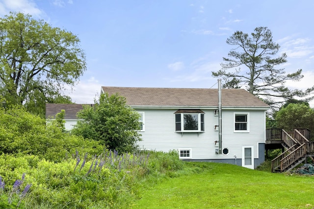 94 Depot St, Waldoboro, ME 04572 - back of property with stairs, a yard, a wooden deck, and roof with shingles