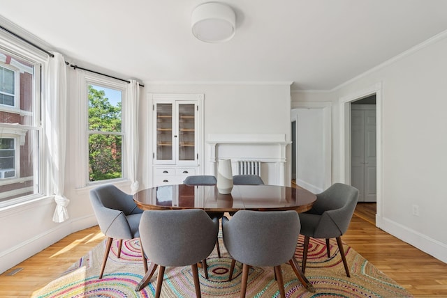 32 State St Unit 5, Portland, ME 04101 - dining room featuring light wood-type flooring and ornamental molding