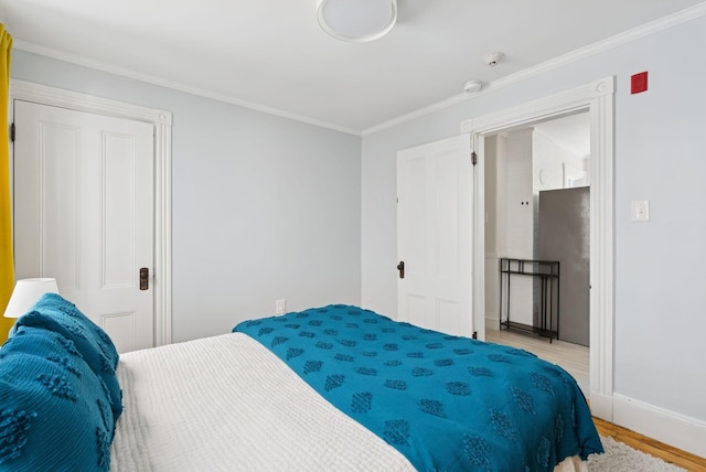 32 State St Unit 5, Portland, ME 04101 - bedroom with light wood-type flooring and crown molding