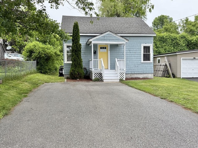 10 Turgeon St, Lewiston, ME 04240 - bungalow-style home with a shingled roof and asphalt driveway