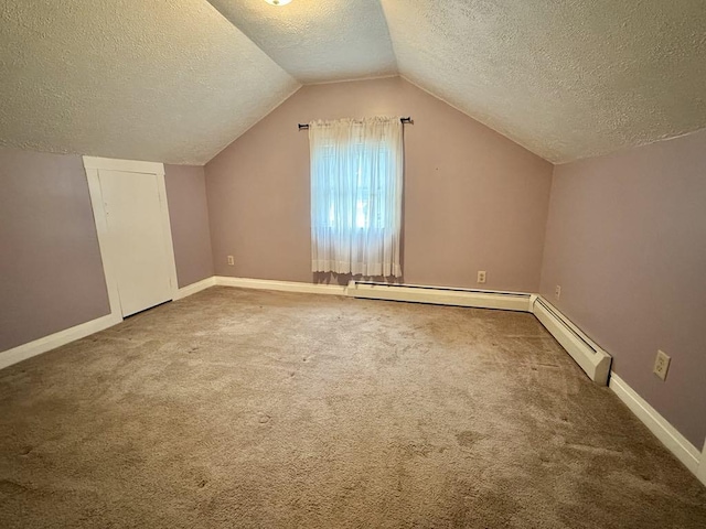 10 Turgeon St, Lewiston, ME 04240 - additional living space featuring a textured ceiling, carpet, lofted ceiling, and a baseboard radiator
