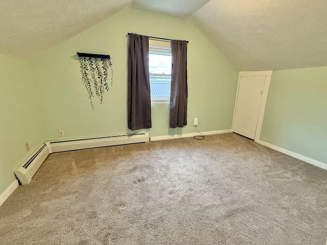 10 Turgeon St, Lewiston, ME 04240 - bonus room featuring a textured ceiling, lofted ceiling, carpet flooring, and a baseboard radiator