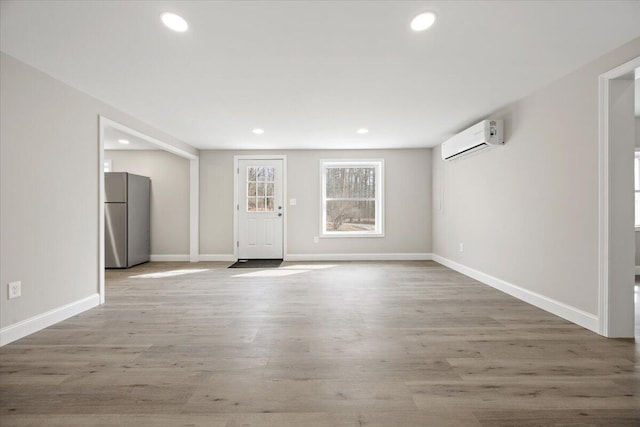 184 Jackson Rd, Waldoboro, ME 04572 - foyer entrance with a wall mounted air conditioner, wood finished floors, and recessed lighting