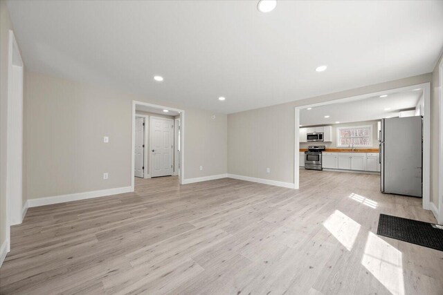 184 Jackson Rd, Waldoboro, ME 04572 - unfurnished living room featuring recessed lighting and light wood-style floors