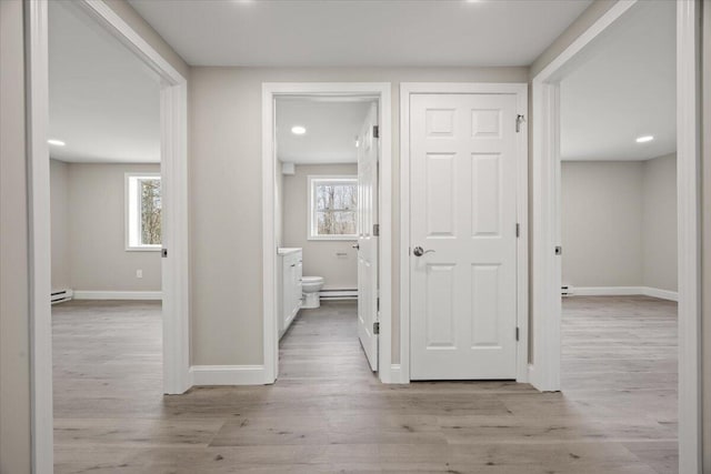 184 Jackson Rd, Waldoboro, ME 04572 - hallway featuring a baseboard radiator, healthy amount of natural light, light wood-style floors, and recessed lighting