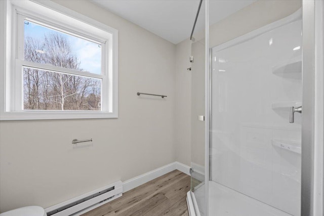 184 Jackson Rd, Waldoboro, ME 04572 - full bath with a baseboard radiator, wood finished floors, a shower stall, and plenty of natural light
