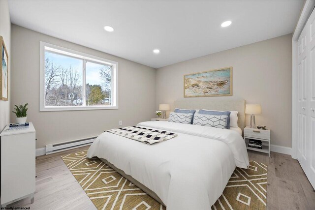 184 Jackson Rd, Waldoboro, ME 04572 - bedroom featuring a baseboard heating unit, light wood-type flooring, recessed lighting, and a closet