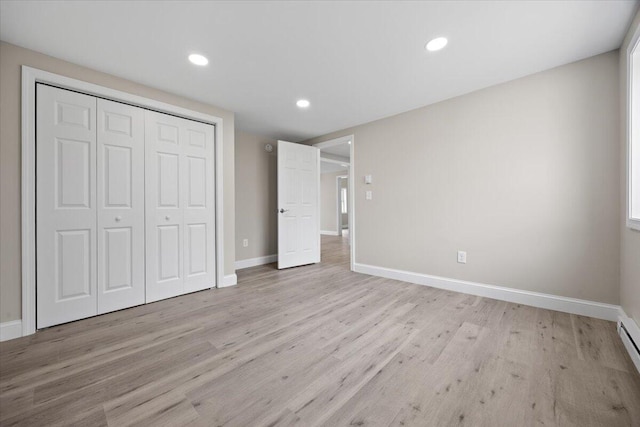 184 Jackson Rd, Waldoboro, ME 04572 - unfurnished bedroom featuring light wood-style floors, recessed lighting, a closet, and baseboard heating