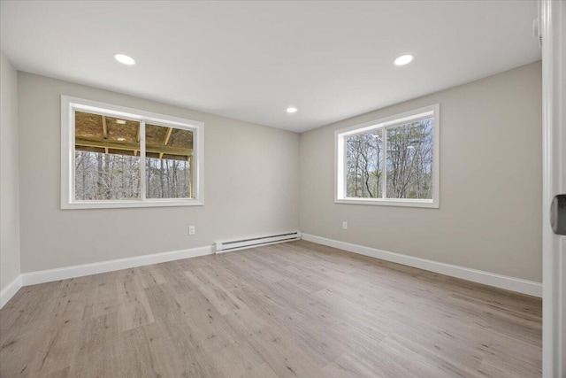 184 Jackson Rd, Waldoboro, ME 04572 - unfurnished room featuring a baseboard heating unit, wood finished floors, and recessed lighting