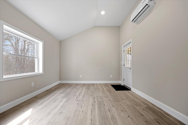 184 Jackson Rd, Waldoboro, ME 04572 - spare room featuring healthy amount of natural light, a wall mounted air conditioner, lofted ceiling, light wood finished floors, and recessed lighting