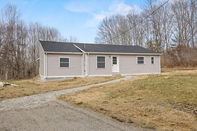 184 Jackson Rd, Waldoboro, ME 04572 - ranch-style home with a front yard, a shingled roof, and entry steps