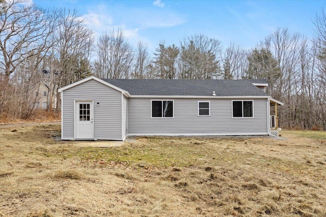 184 Jackson Rd, Waldoboro, ME 04572 - rear view of property featuring roof with shingles and a lawn