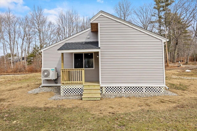 184 Jackson Rd, Waldoboro, ME 04572 - view of side of home with a wooden deck, a lawn, and roof with shingles