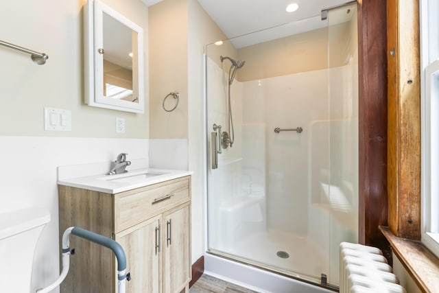 198 N St, Bath, ME 04530 - full bath featuring radiator heating unit, a shower stall, and vanity