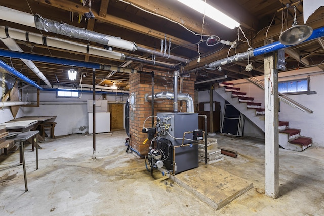 198 N St, Bath, ME 04530 - below grade area featuring stairs, a heating unit, and refrigerator