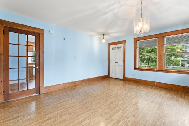 198 N St, Bath, ME 04530 - spare room with a chandelier and wood finished floors