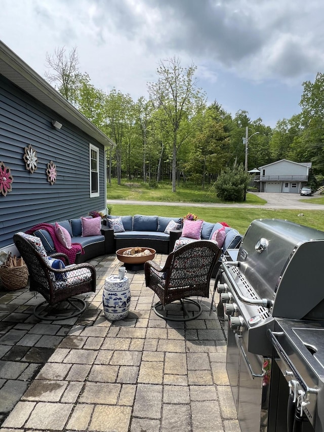 72 Cedar St, Calais, ME 04619 - view of patio with an outdoor living space with a fire pit and grilling area
