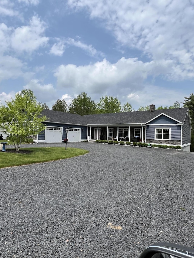 72 Cedar St, Calais, ME 04619 - view of front of house with an attached garage, a chimney, and driveway