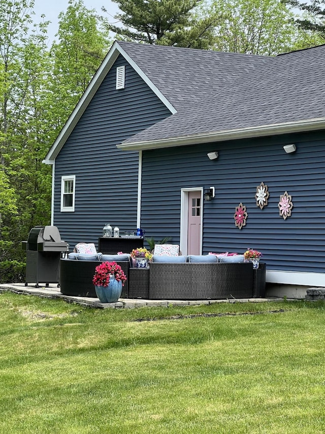 72 Cedar St, Calais, ME 04619 - rear view of property with outdoor lounge area, roof with shingles, and a lawn